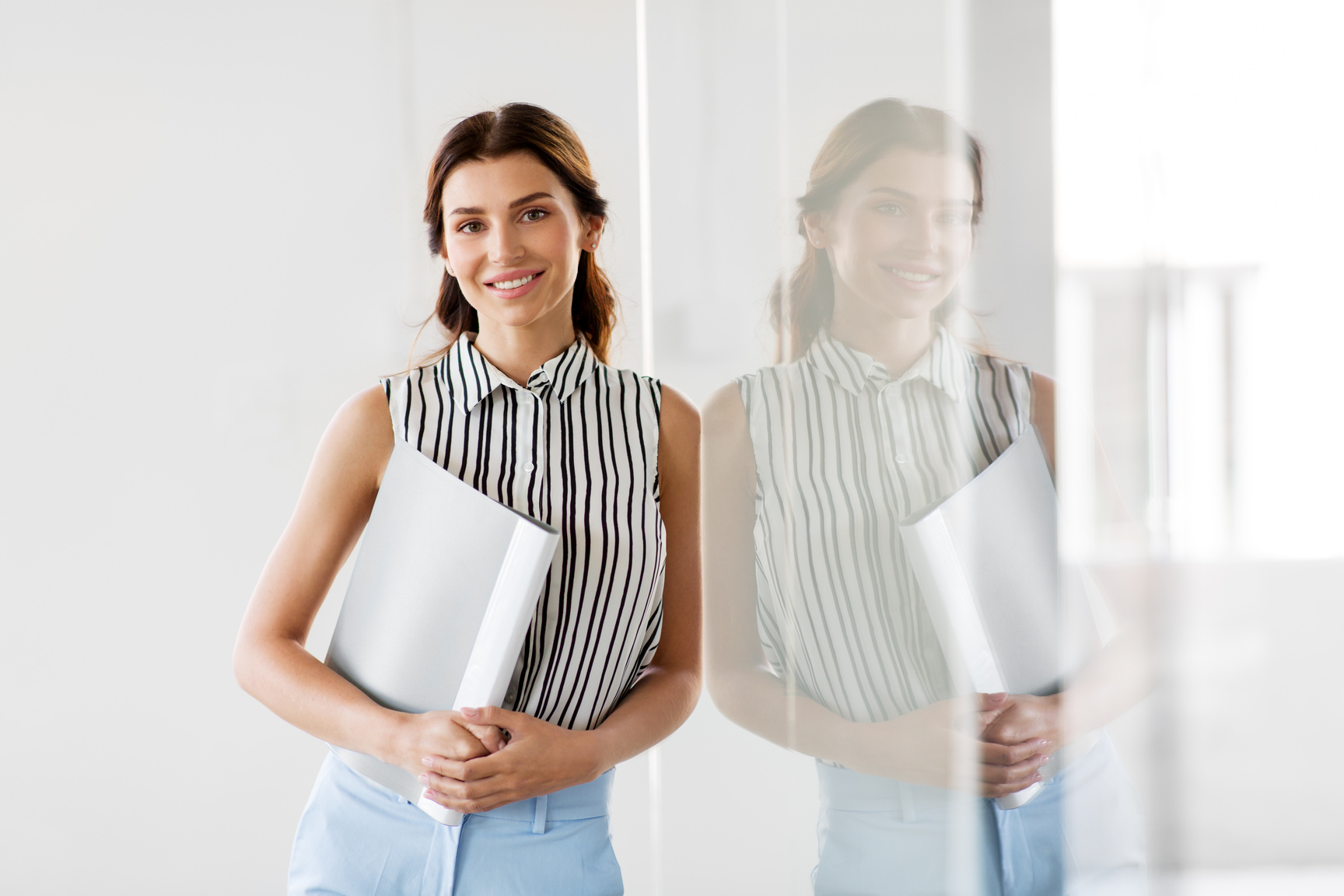 Professional Woman Holding a Folder 
